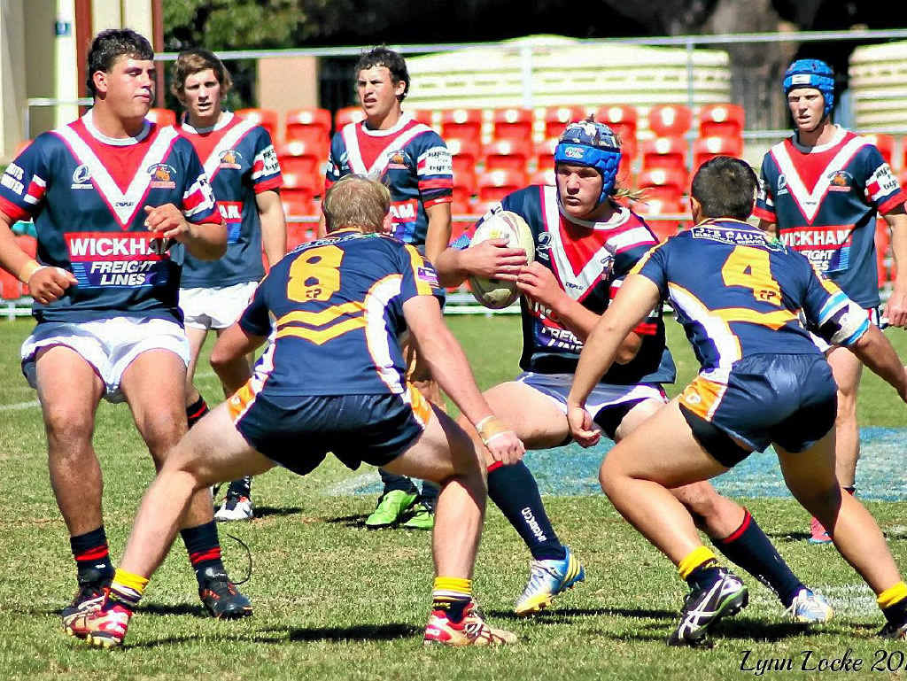 Under 18s Cowboys Player Callum Freeman takes on some Highfields players in last weekend’s clash. Under 18s Cowboys Player Callum Freeman takes on some Highfields players in last weekend’s clash.